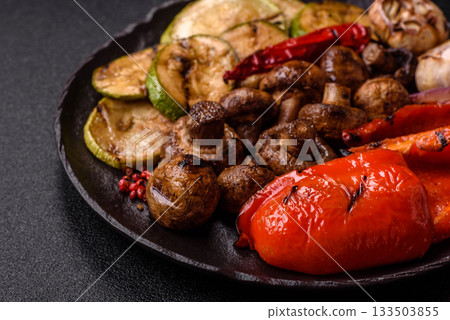 Grilled vegetables, bell peppers, mushrooms, and zucchini, a vegetarian meal. Grilled vegetables 133503855