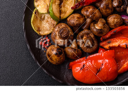 Grilled vegetables, bell peppers, mushrooms, and zucchini, a vegetarian meal. Grilled vegetables Grilled vegetables, bell peppers, mushrooms, and zucchini, a vegetarian meal. Grilled vegetables 133503856