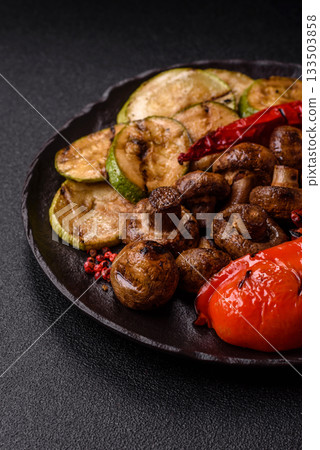 Grilled vegetables, bell peppers, mushrooms, and zucchini, a vegetarian meal. Grilled vegetables 133503858