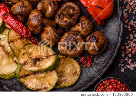 Grilled vegetables, bell peppers, mushrooms, and zucchini, a vegetarian meal. Grilled vegetables 133503860