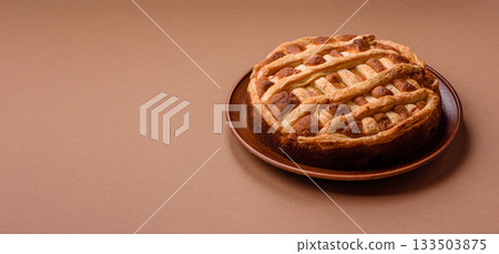 Sweet American pie with apples, pears, and cinnamon, a homemade dessert. Apple American pie Sweet American pie with apples, pears, and cinnamon, a homemade dessert. Apple American pie 133503875