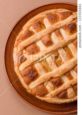 Sweet American pie with apples, pears, and cinnamon, a homemade dessert. Apple American pie Sweet American pie with apples, pears, and cinnamon, a homemade dessert. Apple American pie 133503881