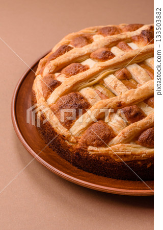 Sweet American pie with apples, pears, and cinnamon, a homemade dessert. Apple American pie 133503882