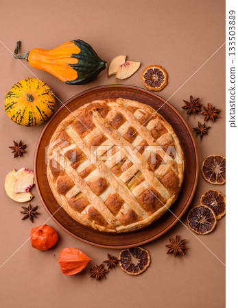 Sweet American pie with apples, pears, and cinnamon, a homemade dessert. Apple American pie Sweet American pie with apples, pears, and cinnamon, a homemade dessert. Apple American pie 133503889