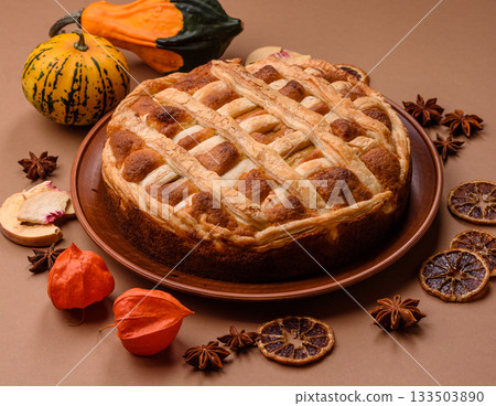 Sweet American pie with apples, pears, and cinnamon, a homemade dessert. Apple American pie Sweet American pie with apples, pears, and cinnamon, a homemade dessert. Apple American pie 133503890