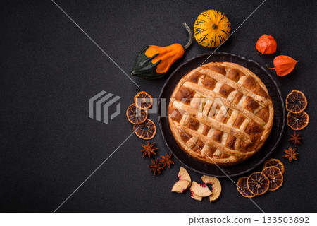Sweet American pie with apples, pears, and cinnamon, a homemade dessert. Apple American pie Sweet American pie with apples, pears, and cinnamon, a homemade dessert. Apple American pie 133503892