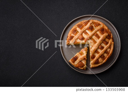 Sweet American pie with apples, pears, and cinnamon, a homemade dessert. Apple American pie 133503908