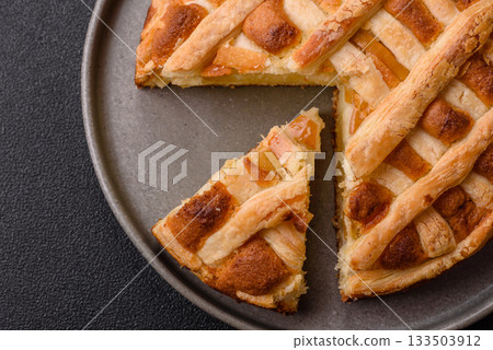 Sweet American pie with apples, pears, and cinnamon, a homemade dessert. Apple American pie 133503912