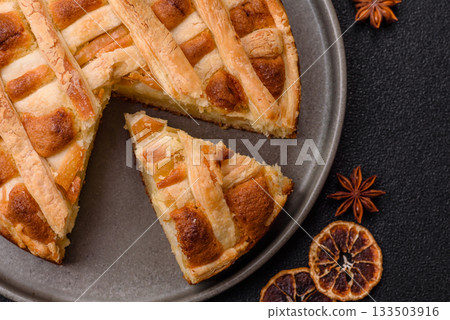 Sweet American pie with apples, pears, and cinnamon, a homemade dessert. Apple American pie 133503916
