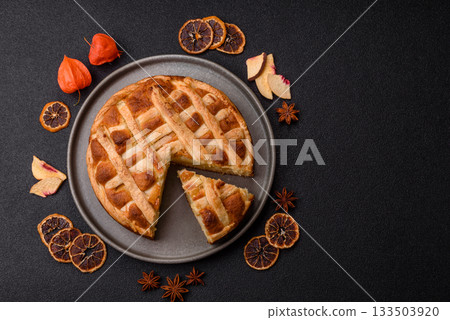 Sweet American pie with apples, pears, and cinnamon, a homemade dessert. Apple American pie Sweet American pie with apples, pears, and cinnamon, a homemade dessert. Apple American pie 133503920