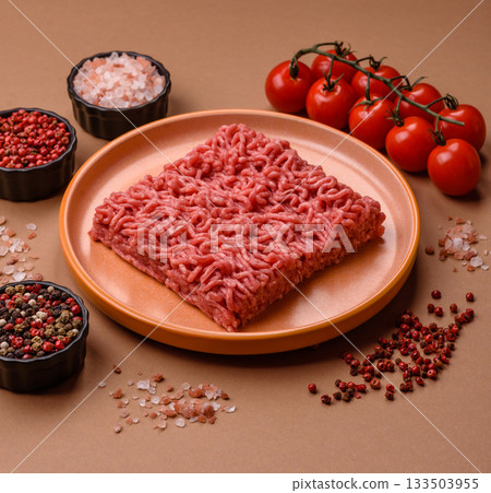 Raw ground beef for a burger or as an ingredient in a meat dish. Raw ground beef 133503955