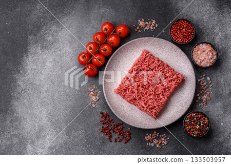 Raw ground beef for a burger or as an ingredient in a meat dish. Raw ground beef 133503957