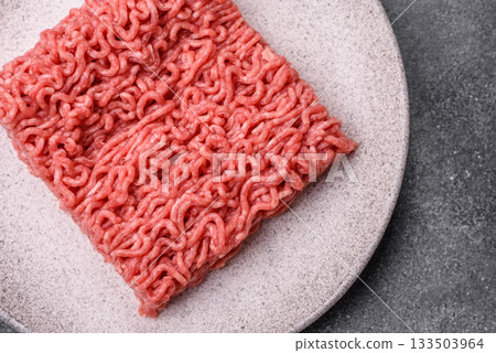 Raw ground beef for a burger or as an ingredient in a meat dish. Raw ground beef Raw ground beef for a burger or as an ingredient in a meat dish. Raw ground beef 133503964