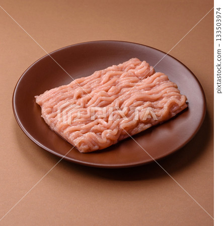 Raw minced chicken for a burger or as an ingredient in a meat dish. Raw ground chicken Raw minced chicken for a burger or as an ingredient in a meat dish. Raw ground chicken 133503974