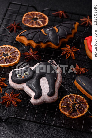 Halloween cookies, sweets, or gingerbread, a cat, a bat, and a hat. Halloween gingerbread Halloween cookies, sweets, or gingerbread, a cat, a bat, and a hat. Halloween gingerbread 133503990
