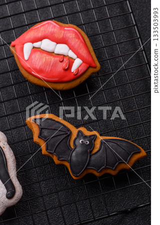 Halloween cookies, sweets, or gingerbread, a cat, a bat, and a hat. Halloween gingerbread 133503993