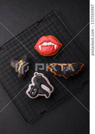Halloween cookies, sweets, or gingerbread, a cat, a bat, and a hat. Halloween gingerbread 133503997