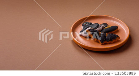 Halloween cookies, sweets, or gingerbread, a cat, a bat, and a hat. Halloween gingerbread 133503999