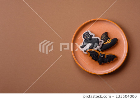 Halloween cookies, sweets, or gingerbread, a cat, a bat, and a hat. Halloween gingerbread 133504000
