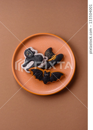 Halloween cookies, sweets, or gingerbread, a cat, a bat, and a hat. Halloween gingerbread Halloween cookies, sweets, or gingerbread, a cat, a bat, and a hat. Halloween gingerbread 133504001