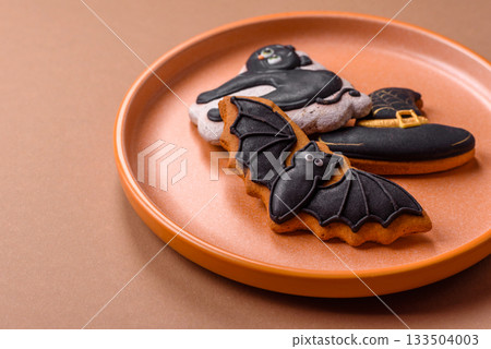 Halloween cookies, sweets, or gingerbread, a cat, a bat, and a hat. Halloween gingerbread 133504003