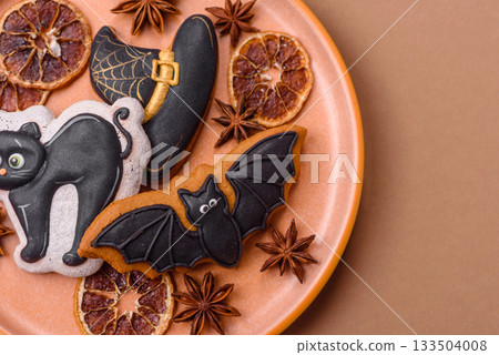 Halloween cookies, sweets, or gingerbread, a cat, a bat, and a hat. Halloween gingerbread Halloween cookies, sweets, or gingerbread, a cat, a bat, and a hat. Halloween gingerbread 133504008