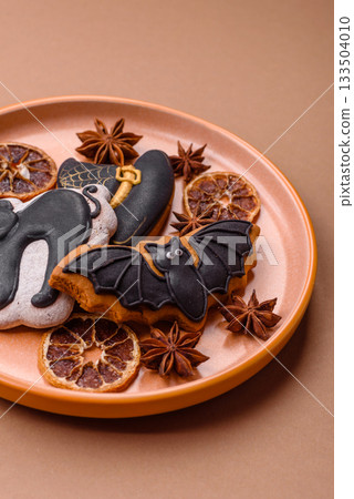 Halloween cookies, sweets, or gingerbread, a cat, a bat, and a hat. Halloween gingerbread 133504010