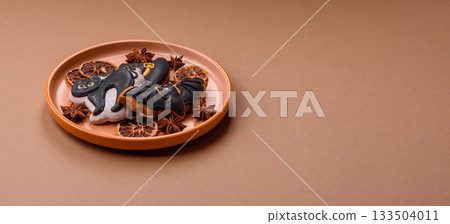 Halloween cookies, sweets, or gingerbread, a cat, a bat, and a hat. Halloween gingerbread Halloween cookies, sweets, or gingerbread, a cat, a bat, and a hat. Halloween gingerbread 133504011