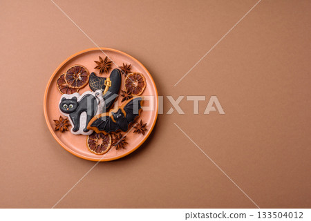 Halloween cookies, sweets, or gingerbread, a cat, a bat, and a hat. Halloween gingerbread Halloween cookies, sweets, or gingerbread, a cat, a bat, and a hat. Halloween gingerbread 133504012