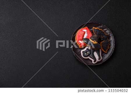 Halloween cookies, sweets, or gingerbread, a cat, a bat, and a hat. Halloween gingerbread 133504032