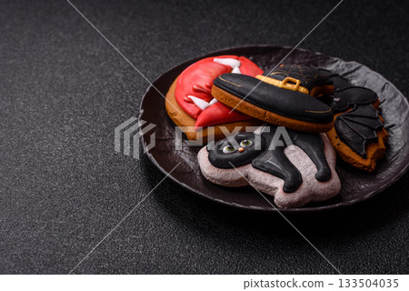 Halloween cookies, sweets, or gingerbread, a cat, a bat, and a hat. Halloween gingerbread Halloween cookies, sweets, or gingerbread, a cat, a bat, and a hat. Halloween gingerbread 133504035