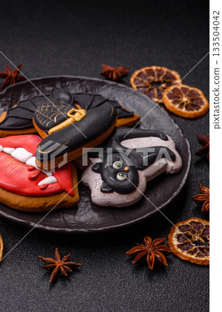 Halloween cookies, sweets, or gingerbread, a cat, a bat, and a hat. Halloween gingerbread Halloween cookies, sweets, or gingerbread, a cat, a bat, and a hat. Halloween gingerbread 133504042