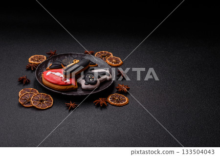 Halloween cookies, sweets, or gingerbread, a cat, a bat, and a hat. Halloween gingerbread Halloween cookies, sweets, or gingerbread, a cat, a bat, and a hat. Halloween gingerbread 133504043