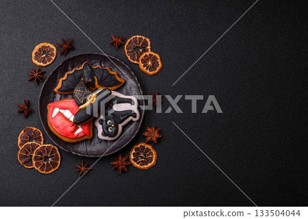 Halloween cookies, sweets, or gingerbread, a cat, a bat, and a hat. Halloween gingerbread 133504044