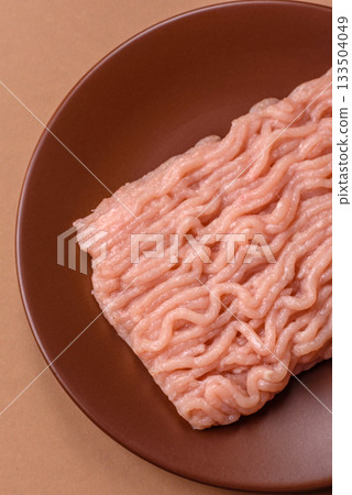 Raw minced chicken for a burger or as an ingredient in a meat dish. Raw ground chicken Raw minced chicken for a burger or as an ingredient in a meat dish. Raw ground chicken 133504049