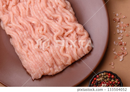 Raw minced chicken for a burger or as an ingredient in a meat dish. Raw ground chicken 133504052