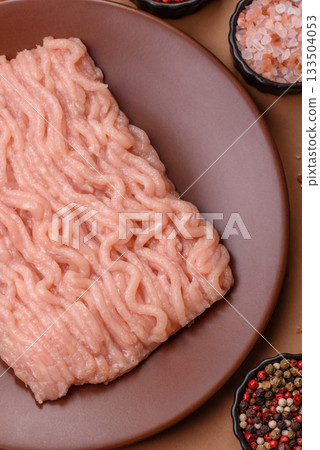 Raw minced chicken for a burger or as an ingredient in a meat dish. Raw ground chicken 133504053