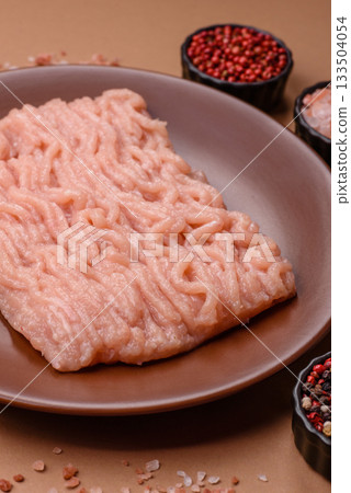 Raw minced chicken for a burger or as an ingredient in a meat dish. Raw ground chicken 133504054