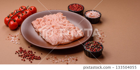 Raw minced chicken for a burger or as an ingredient in a meat dish. Raw ground chicken 133504055
