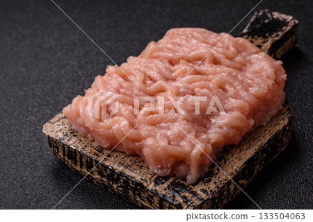 Raw minced chicken for a burger or as an ingredient in a meat dish. Raw ground chicken 133504063