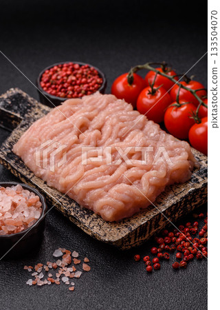 Raw minced chicken for a burger or as an ingredient in a meat dish. Raw ground chicken 133504070