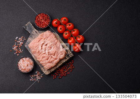 Raw minced chicken for a burger or as an ingredient in a meat dish. Raw ground chicken 133504073