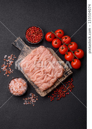 Raw minced chicken for a burger or as an ingredient in a meat dish. Raw ground chicken 133504074