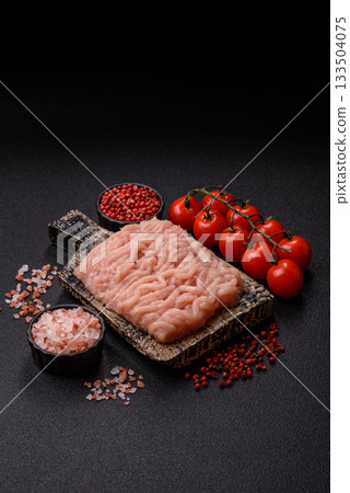 Raw minced chicken for a burger or as an ingredient in a meat dish. Raw ground chicken 133504075