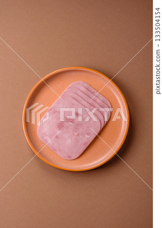 Meat, square ham sliced, organic food, protein for snacks. Sliced ham as a background 133504154