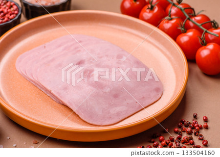 Meat, square ham sliced, organic food, protein for snacks. Sliced ham as a background Meat, square ham sliced, organic food, protein for snacks. Sliced ham as a background 133504160