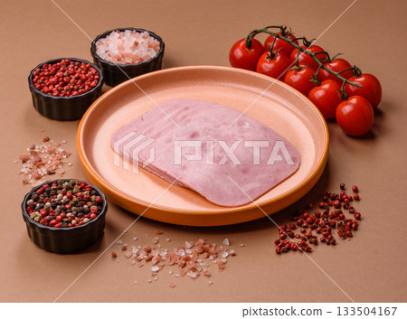 Meat, square ham sliced, organic food, protein for snacks. Sliced ham as a background Meat, square ham sliced, organic food, protein for snacks. Sliced ham as a background 133504167