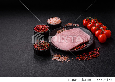 Meat, square ham sliced, organic food, protein for snacks. Sliced ham as a background Meat, square ham sliced, organic food, protein for snacks. Sliced ham as a background 133504168