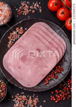 Meat, square ham sliced, organic food, protein for snacks. Sliced ham as a background Meat, square ham sliced, organic food, protein for snacks. Sliced ham as a background 133504173
