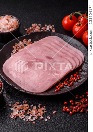 Meat, square ham sliced, organic food, protein for snacks. Sliced ham as a background Meat, square ham sliced, organic food, protein for snacks. Sliced ham as a background 133504174